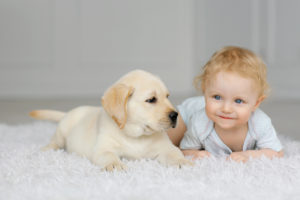Baby girl with puppy